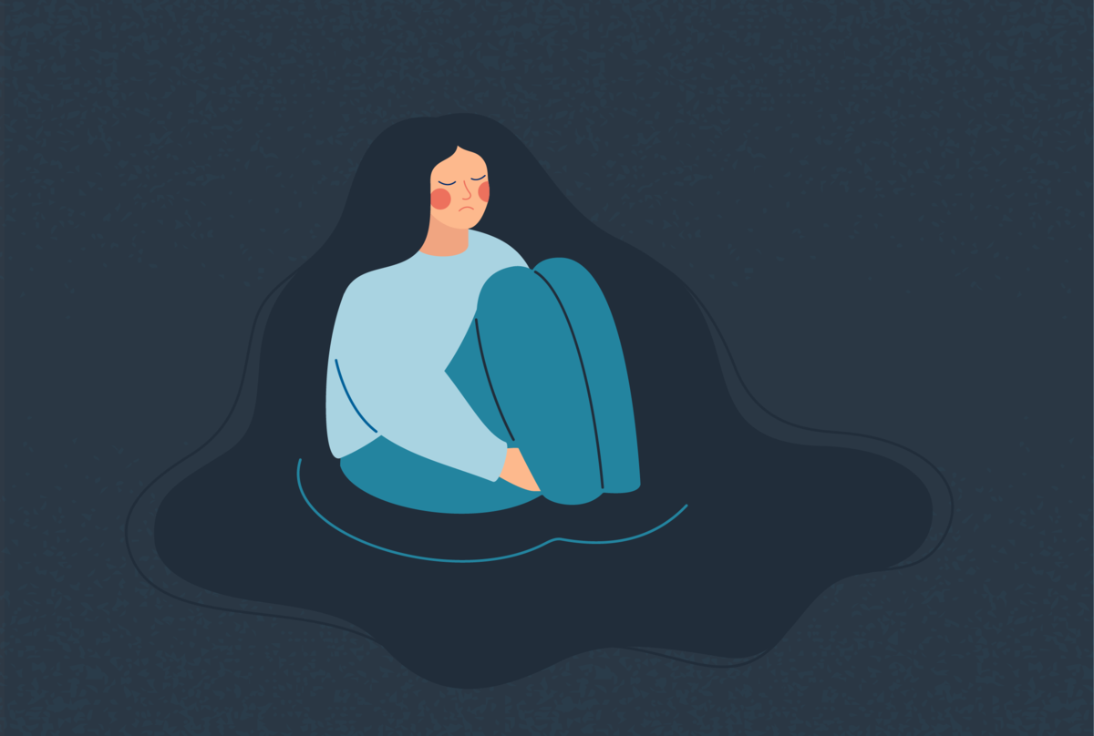 Na obrazku widzimy smutną osobę.